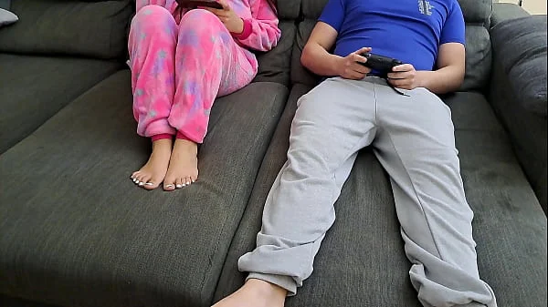Stepsister sucks stepbrother and eats his sperm while he plays video games