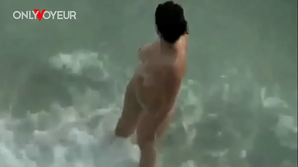 Busty amateur nudist swimming naked and getting her pussy licked and fucked on a public beach