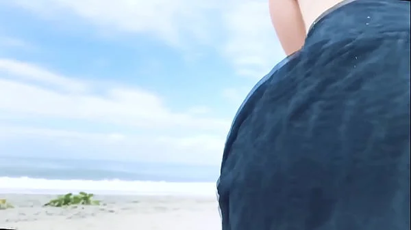 Vacationers look on with disapproval as a milf with her BF films anal content right on the beach