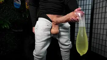 Huge white cock cums in condom until it explodes and drinks piss VS World Biggest Cock