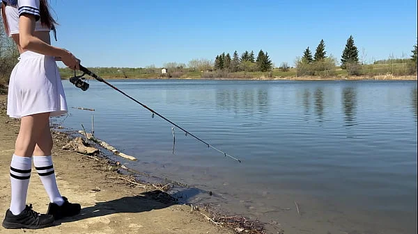 Young angler girl went to fish after school