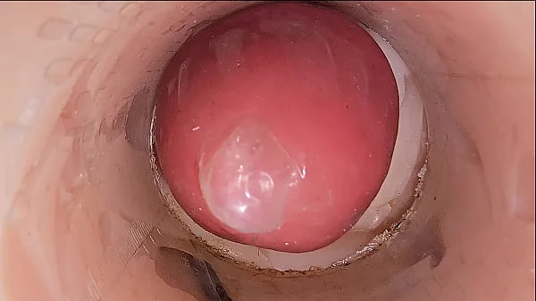 The camera in the deep pussy records a huge ejaculation of sperm into the condom