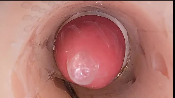 The camera in the deep pussy records a huge ejaculation of sperm into the condom