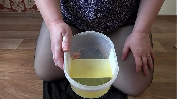 Golden shower and hairy pussy, mature milf with a fat ass records a video for a fetish friend.