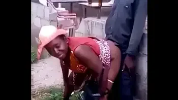 African woman fucks her man in public
