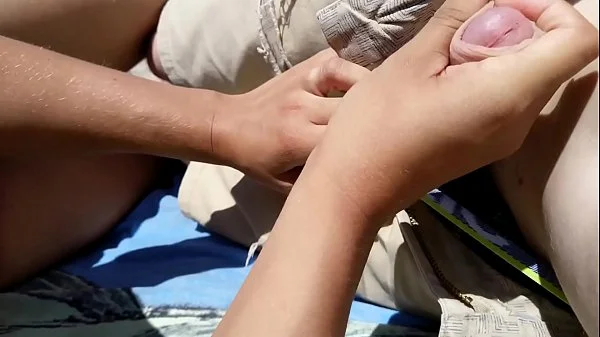 Girl Masturbates boyfriend on a public beach