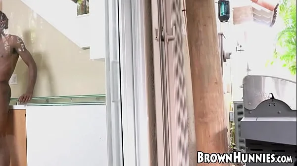 Cute black chick caught her guy wanking and gives him a hand