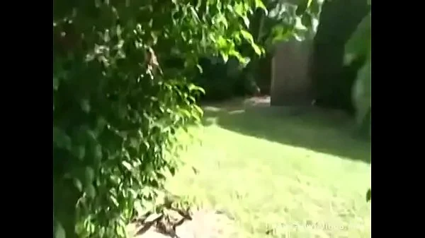 Big tit girlfriend giving a handjob outside by the pool