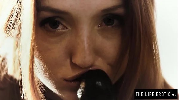 Freckle faced redhead in straps rides a giant dildo really hard