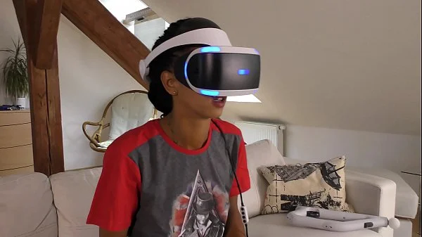 Isabel flashes her pussy and ass under her panties with a tshirt and she has a new game in her Playstation VR but she needs..