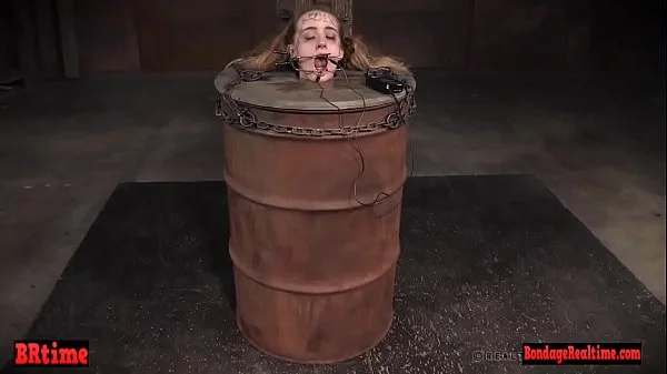 Bdsm babe trapped in a barrel and electrified