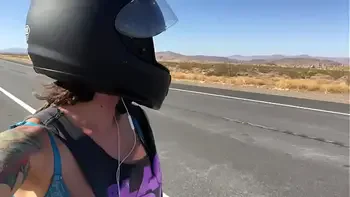 felicity feline riding on aprilia tuono motorcycle