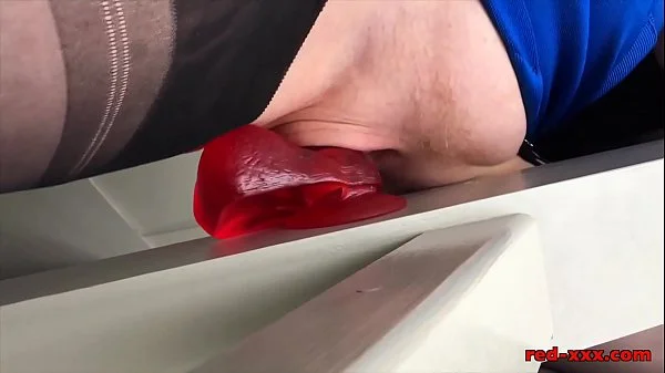 Busty mature Red XXX fucks her dildo on the stairs