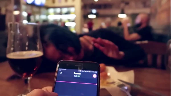 I took control of my stepsister's vibrator in the bar and brought her to orgasm.