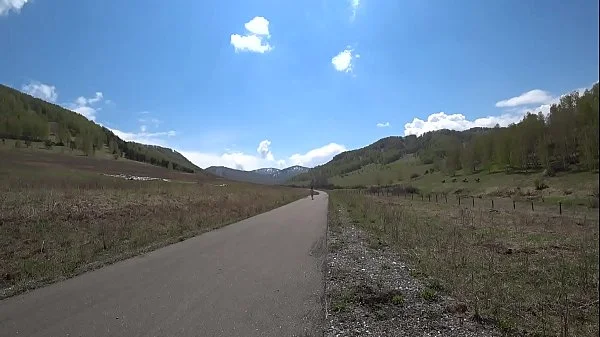 Outdoor exhibitionism. A completely naked babe with a sexy figure, juicy PAWG, and hairy pussy walks in high-heeled sandals on the road. Amateur fetish.