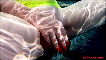 Red Xxx In Fucks Her Pussy With A Toy In The Pool