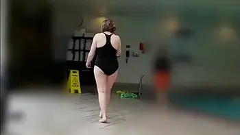 Sexy Grandma is Sexy at 66 in a black swimsuit