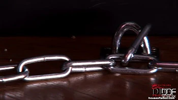 Bound latex-wearing Bailey peeing