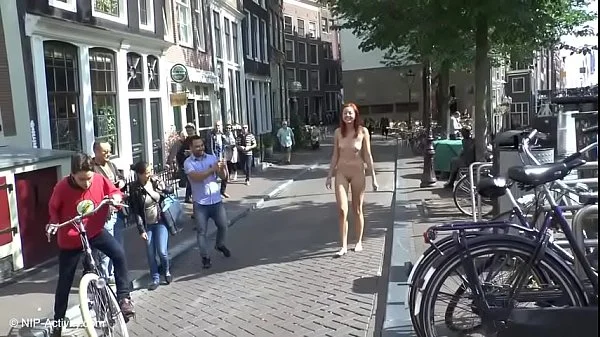 Pretty redhead walking naked in Amsterdam