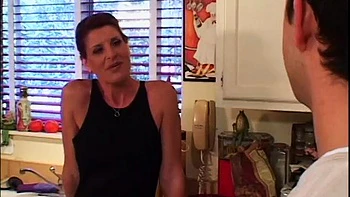 Mature redhead pounded in the kitchen