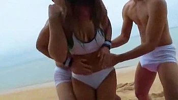 She gets touched by two men and they thrust deep into her throat and cum in her mouth.