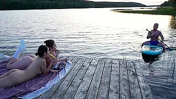 Two Girls Took Their Clothes Off On The Lake. A Passing Surfer Had Sex In The Open Air