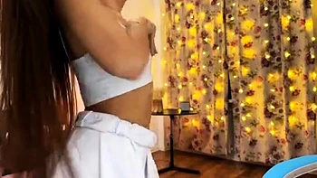 Small titted brunette teen fingering on the bed