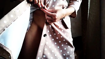 Gorgeous babe with big tits teases in a sexy BDSM dress.