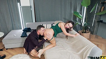 Pavlos and Sakura Hell in a steamy session on the sofa, showcasing her trimmed pussy.