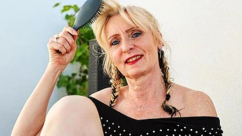 Mature chubby blonde Ella Rosalia sticks a dildo in her shaved pussy