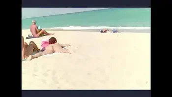 Exhibitionist Wife 23 - Lana is Filmed by her husband at the NUDE BEACH teasing a VOYEUR and showing off her ASSHOLE, MEATY PUSSY AND CLIT  in PUBLIC!!!