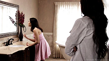 Curly-haired seductress rides cock in classroom bed