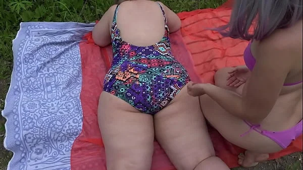 Mature lesbians with big asses in swimsuits sunbathe in nature and have fun with a rubber dick. Amateur fetish outdoor and juicy PAWG shaking doggystyle.