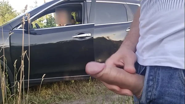 I pull out my cock on a beach area. This young woman who drives from this beach, looks shocked by what she sees !! She want look how i cum
