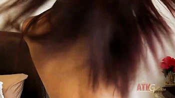 Petite brunette rubs clit with vibrator solo
