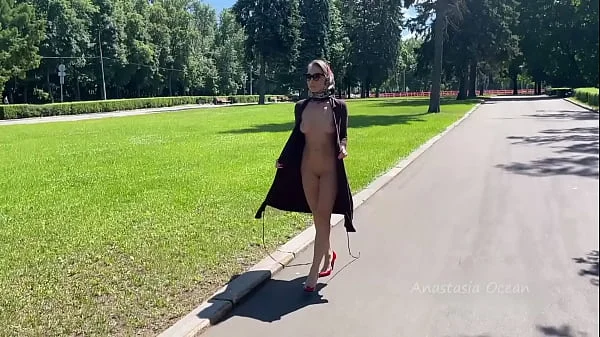 Stylish Lady walks naked in park. Public