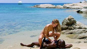 Blonde Joss and brunette Tiffany ride big black cock on beach