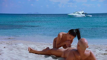 Two kissing babes, including stunning peaches, enjoy a hot beach sex adventure